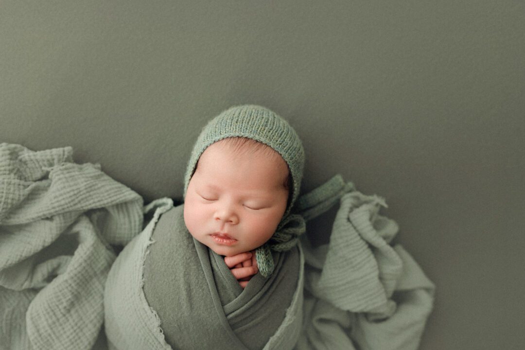 Newborn baby photographed at EvaGud Photography studio in Barking