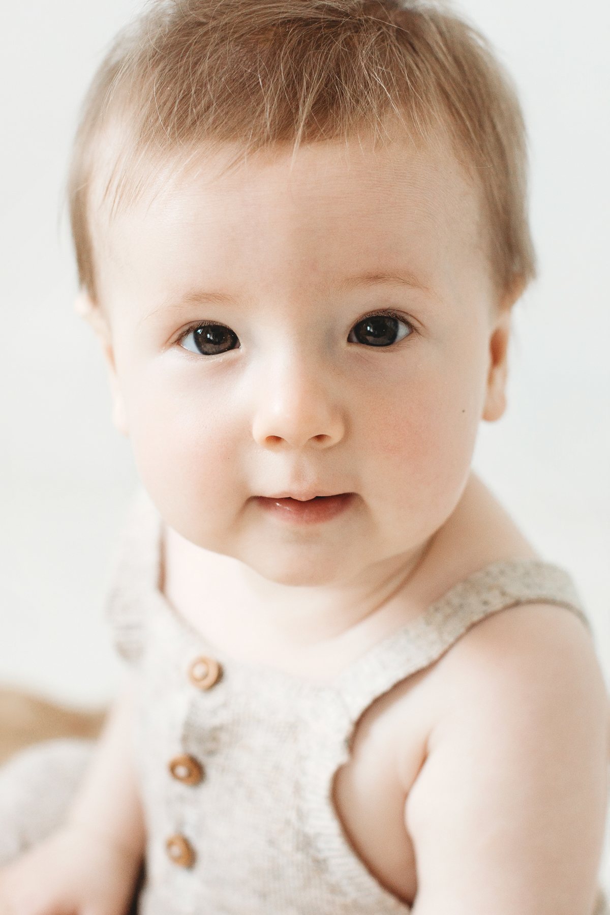 Close-up portrait of a baby at a milestone mini session in East London